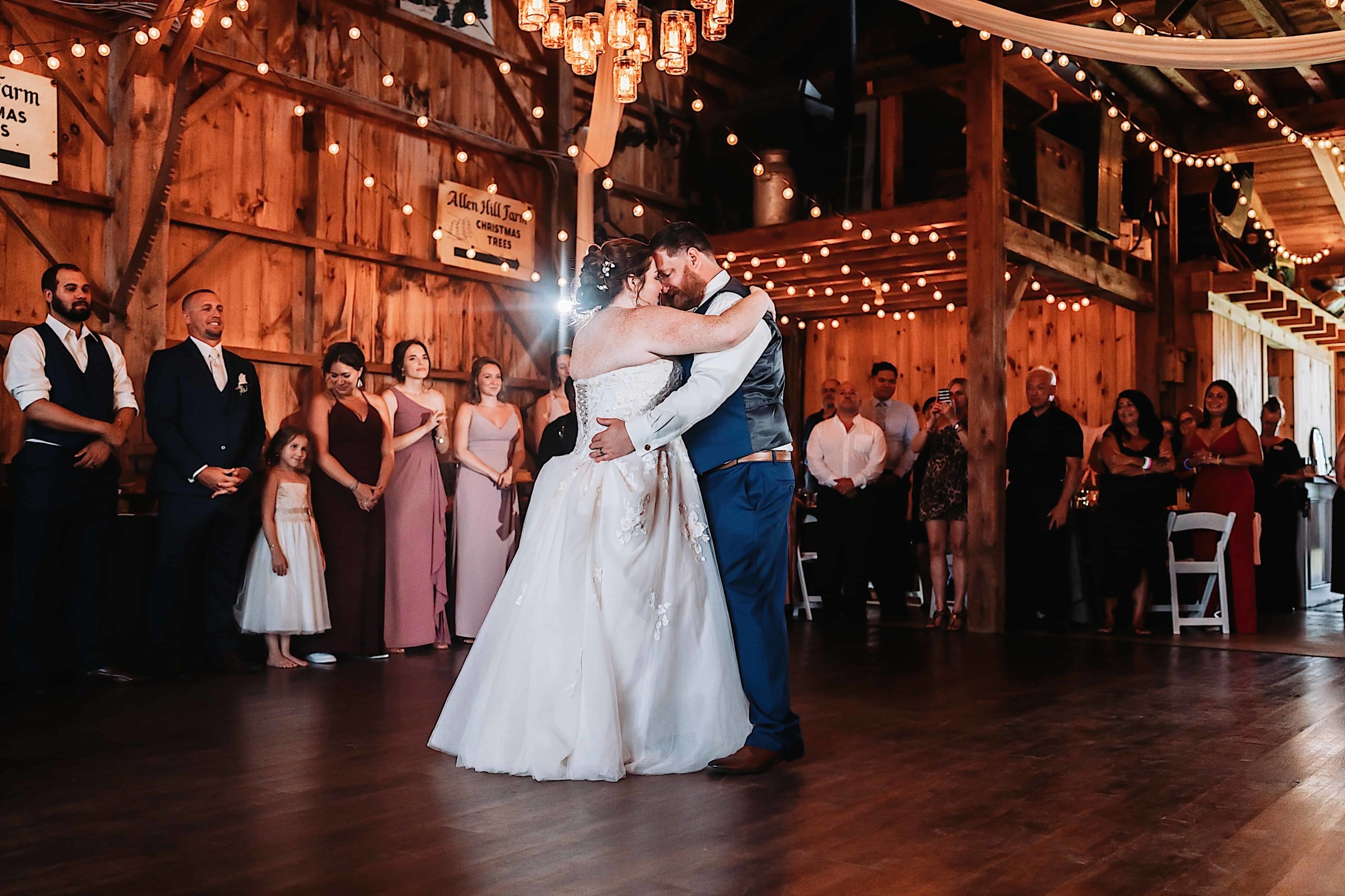Wedding couple sharing a first dance at Wrights Mill Farm rustic bar wedding venue in connecticut