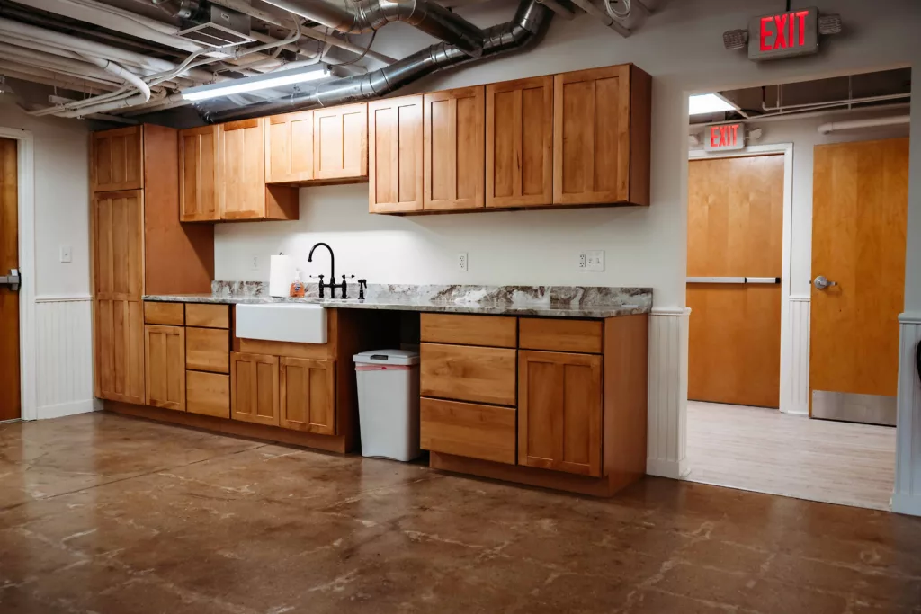 Station 97s kitchenette area showing cabinets and countertops.