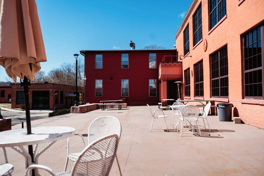 Station 97 outdoor concrete patio with tables and chairs