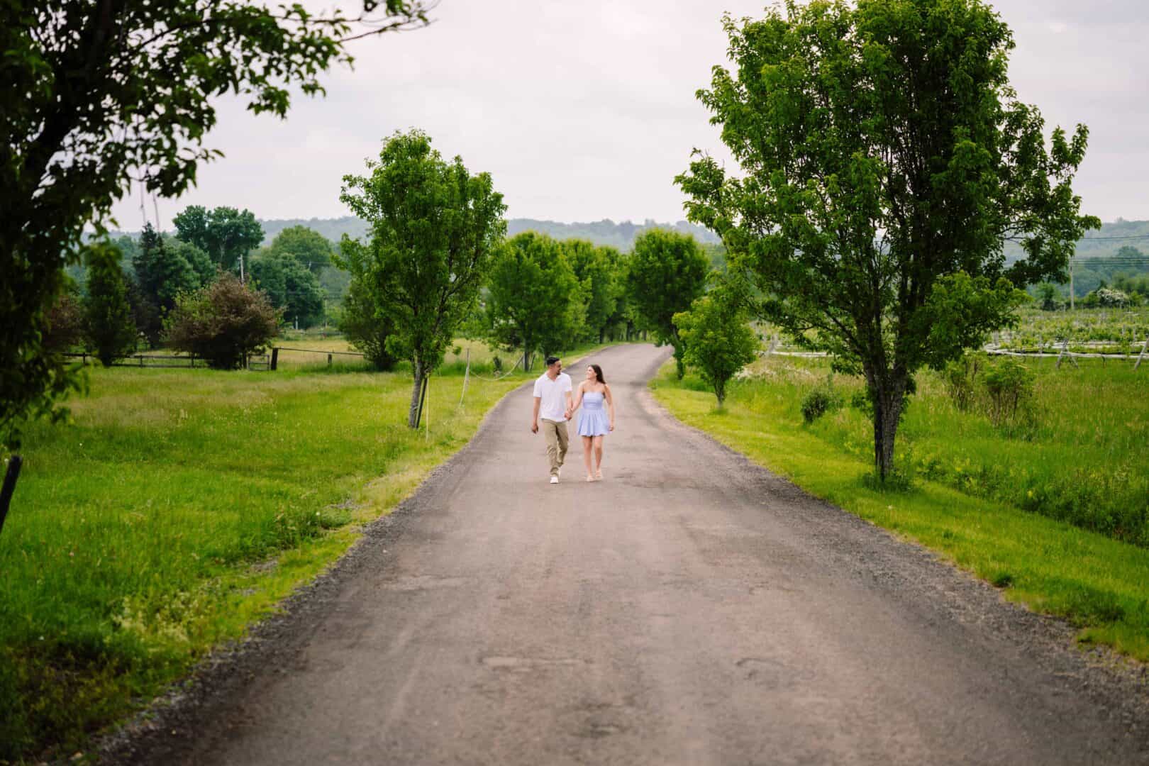 A couple walking down a country road