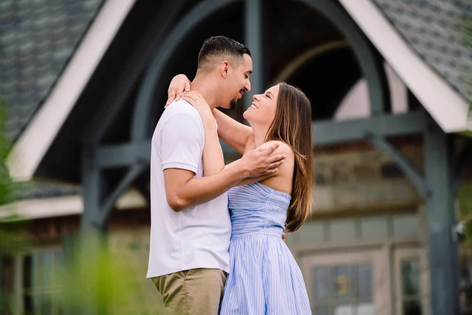 a man and woman hugging outside